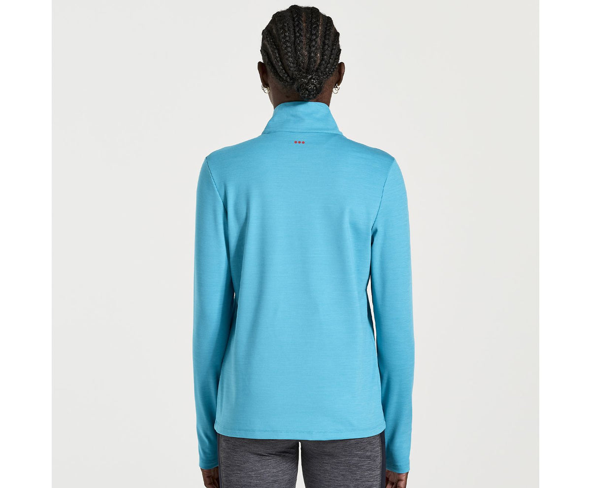 Women's Saucony Solstice 1/4 zip. Blue. Rear view.