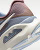Close-up of a sneaker with 'zoomx' logo on a white background