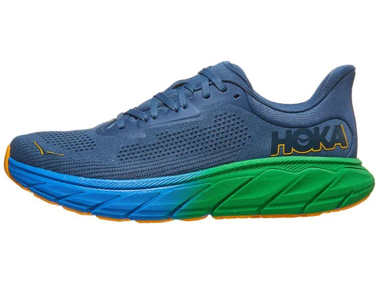 Men's Hoka Arahi 7. Blue upper. Blue and Green midsole. Lateral View. 