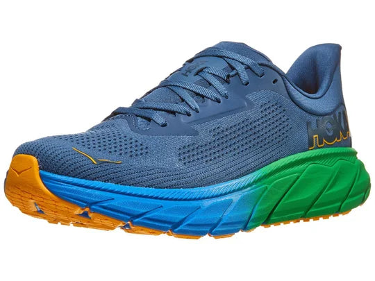 Men's Hoka Arahi 7. Blue upper. Green and blue midsole. Lateral view. 