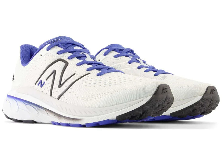 Men's New Balance 860v13. White upper. White midsole. Lateral view.