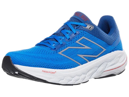 Men's New Balance 860 V14. Blue upper. White midsole. Lateral view.