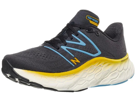 Men's New Balance More V4. Dark Grey upper. White midsole. Lateral view.