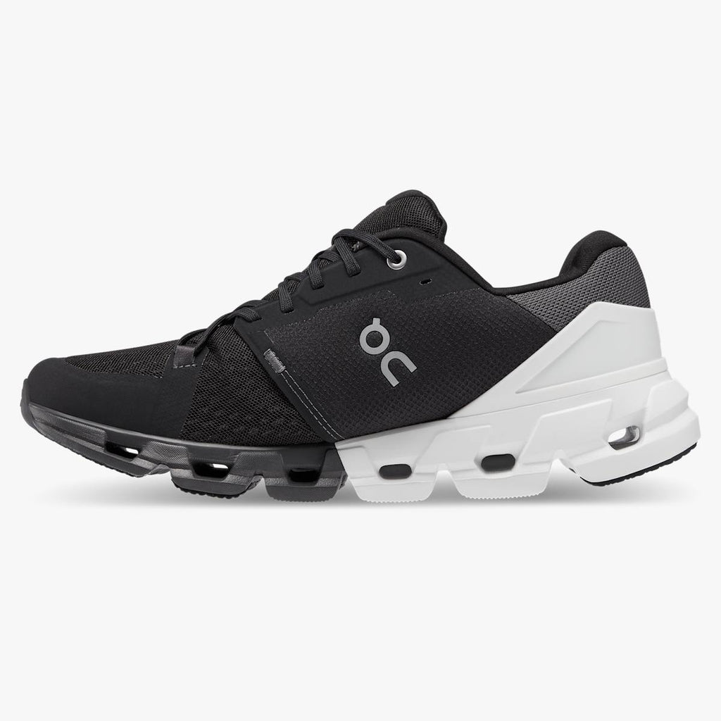 Men's On Cloudflyer 4. Black upper. Black midsole. Medial view.
