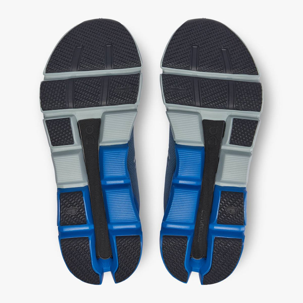 Men's On Cloudflyer 4. Blue/Grey upper. White midsole. Bottom view.