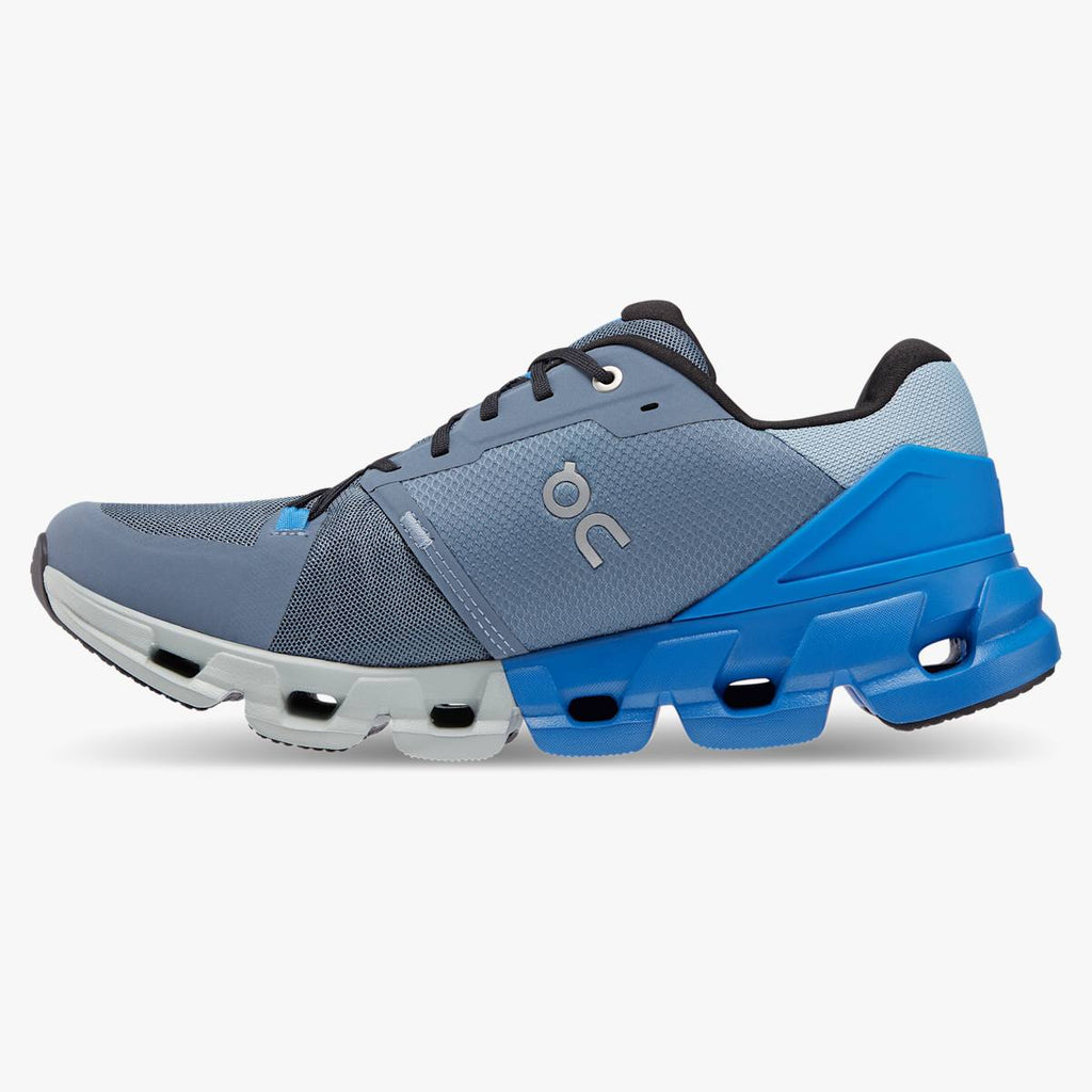 Men's On Cloudflyer 4. Blue/Grey upper. White midsole. Medial view.