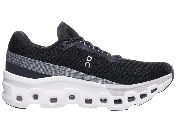 Men's On Cloudmonster 2. Black upper. White midsole. Medial view.