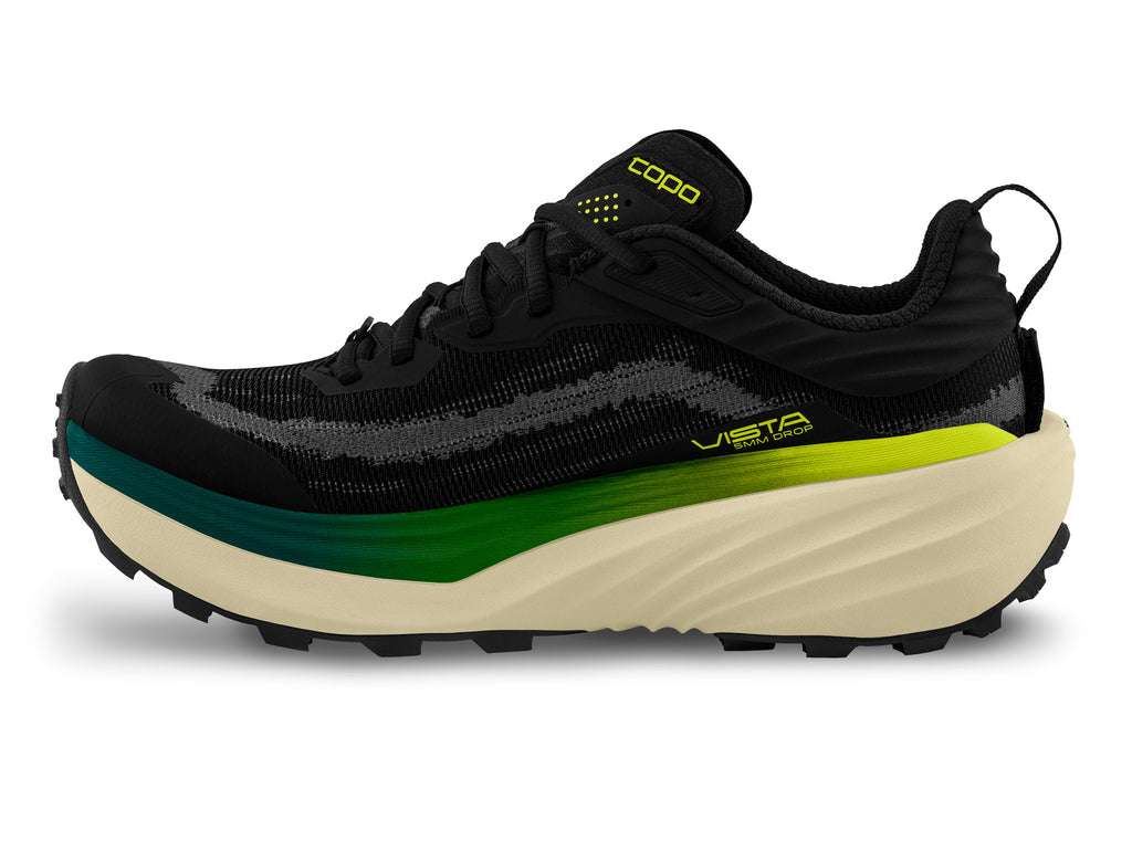 Men's Topo Vista. Black upper. Tan midsole. Medial view.