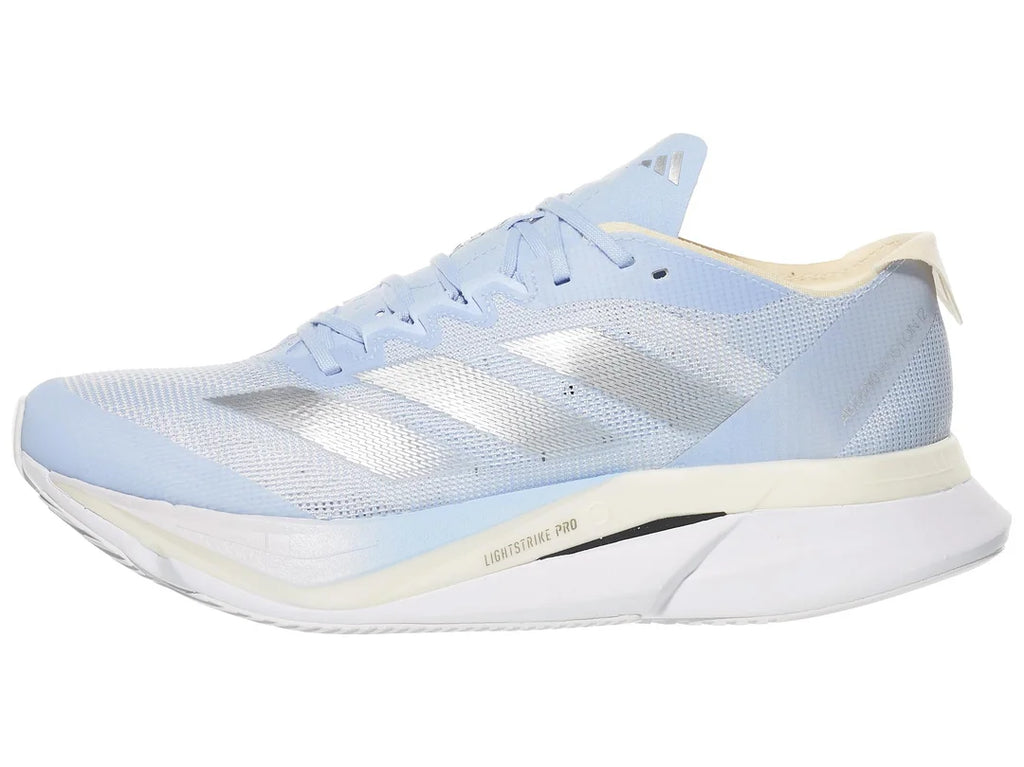 Women's Adidas Adizero Boston 12. Blue upper. Blue, cream, and white midsole. Grey logo. Lateral view.