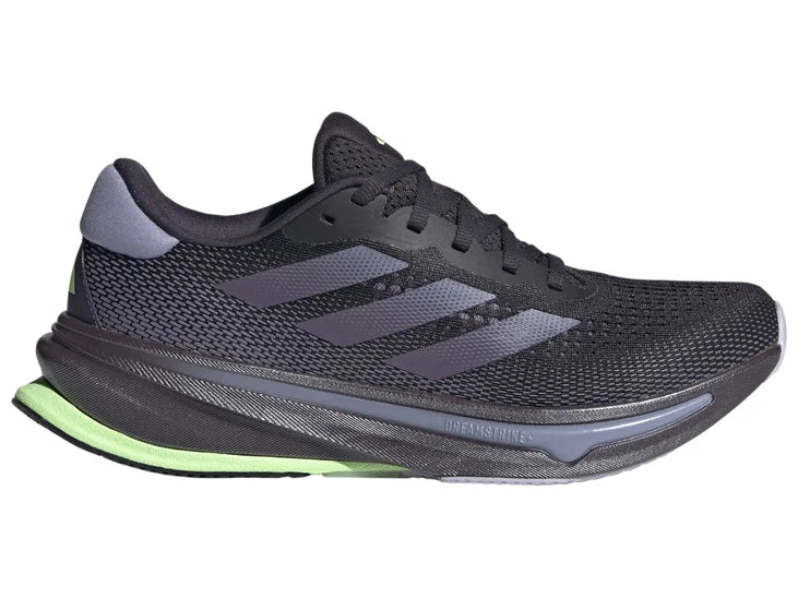 black sneaker with purple-gray stripes. lateral view.