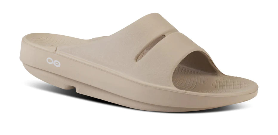 Oofos Ooahh Slide. Tan. Lateral view.