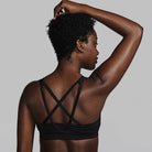 Women's Saucony Kinvara Bra Top. Black. Back view.