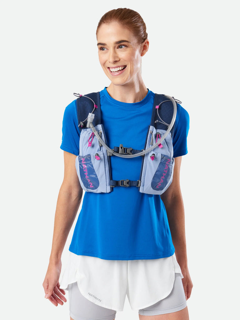 Women's Nathan Vapor Airess 3.0 7 Liter Hydration Vest. Light Blue. Front view.
